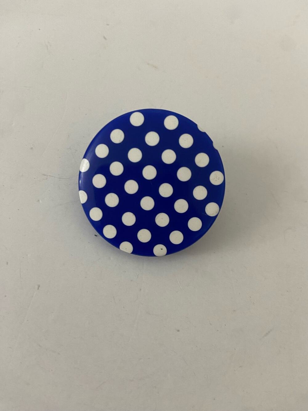 blue and white polka dot pin